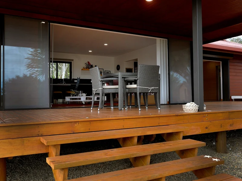 Timber framed patio cover over a composite deck with lit steps