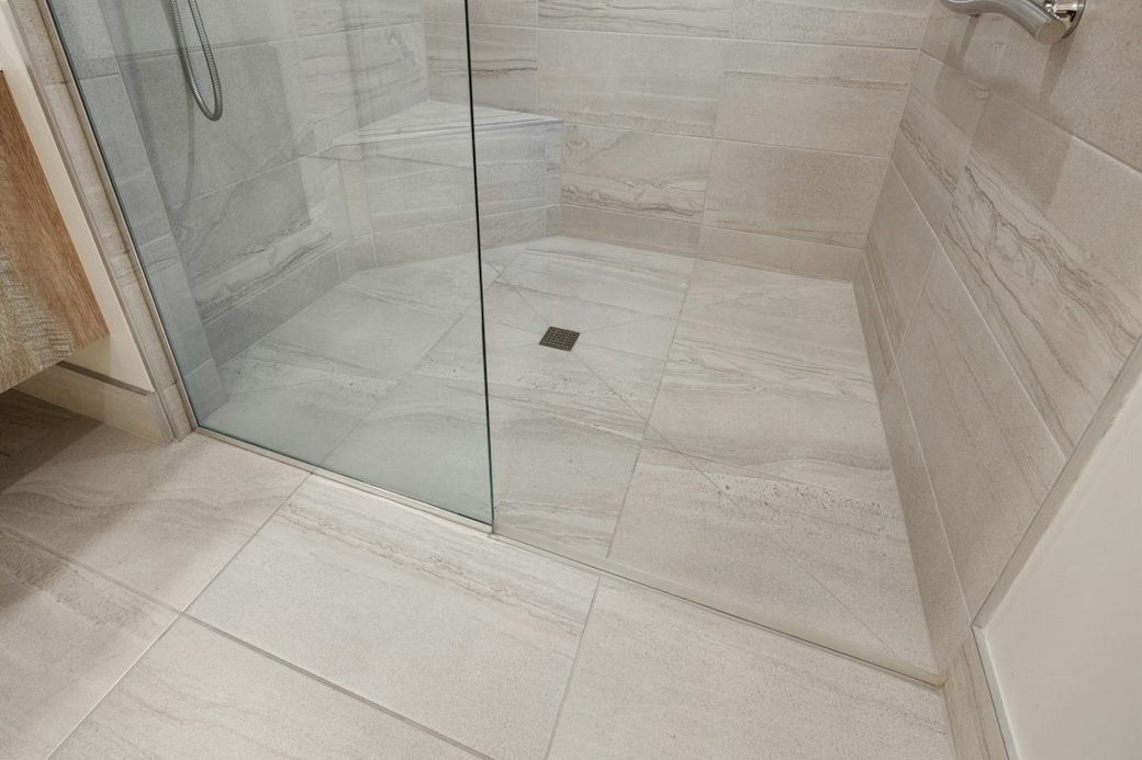 Glass shower stall with tile floor