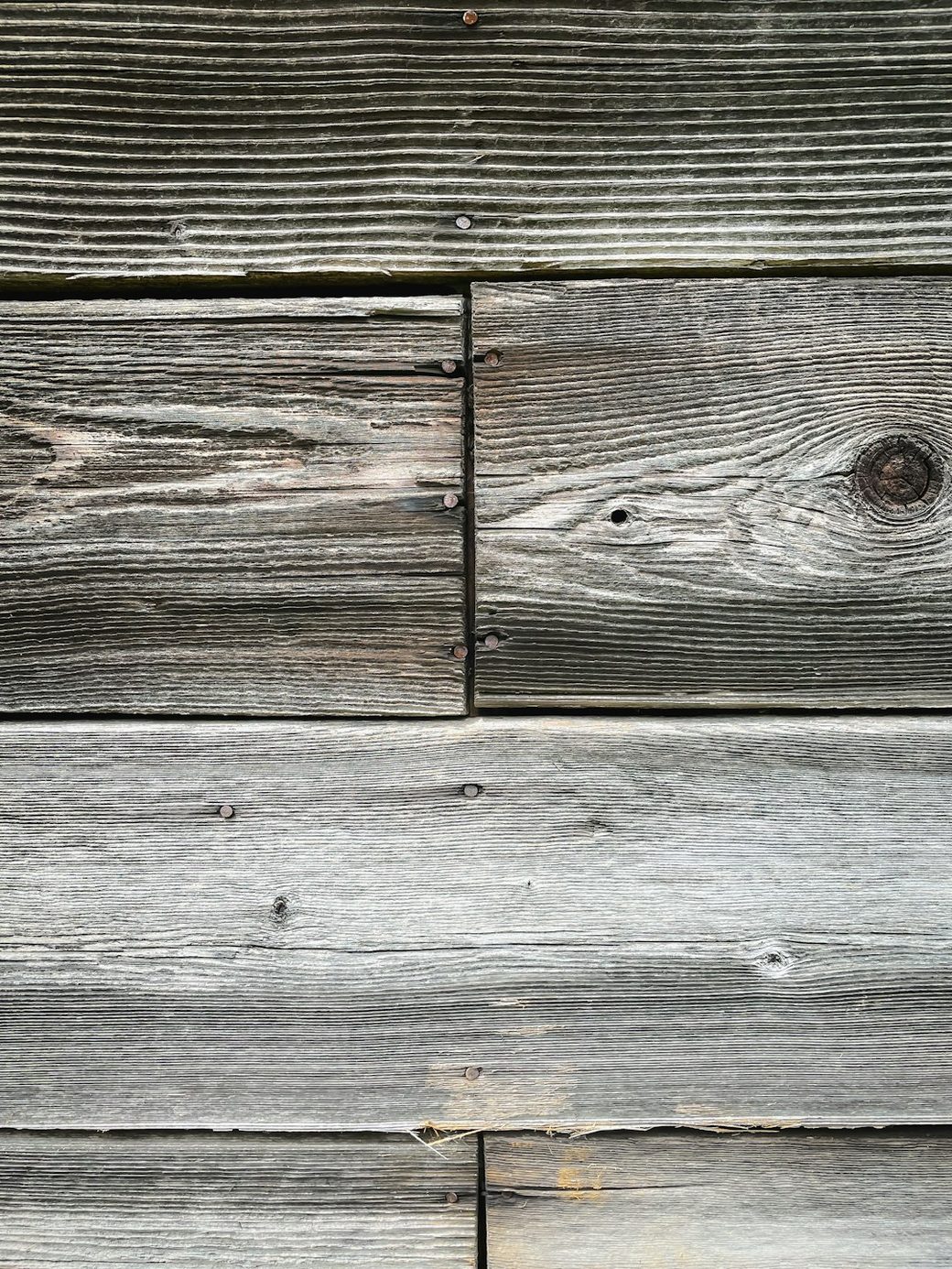 Weathered wood siding with knot detail