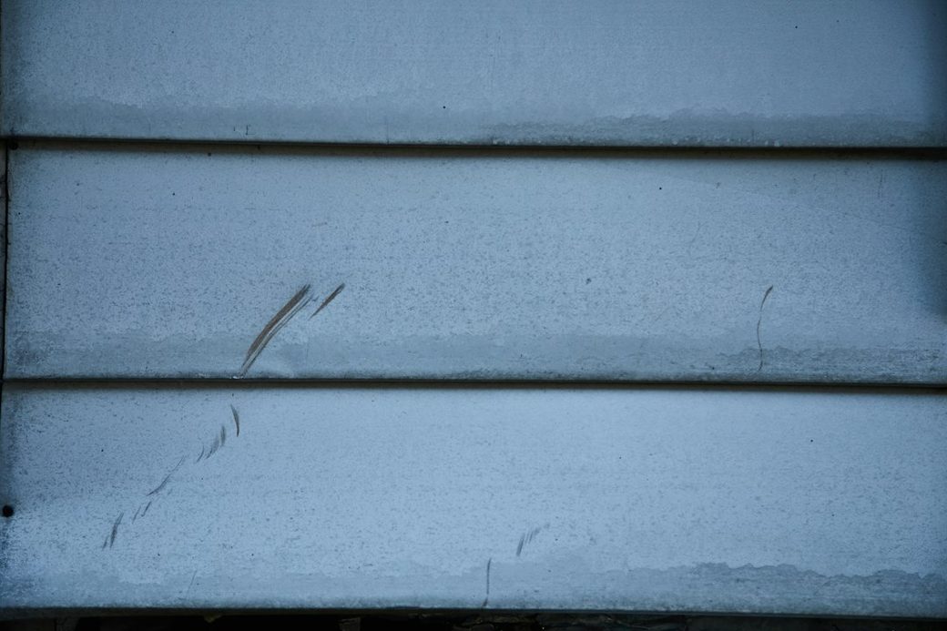 Cracked wood siding boards closeup