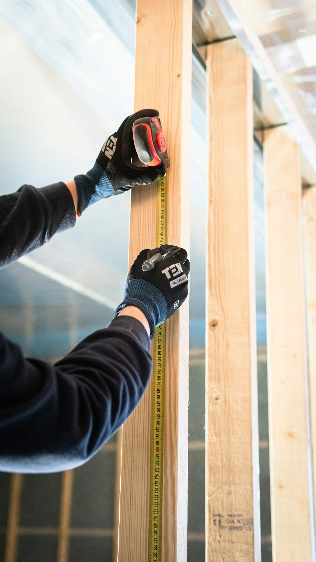 Measuring wall stud framing during construction