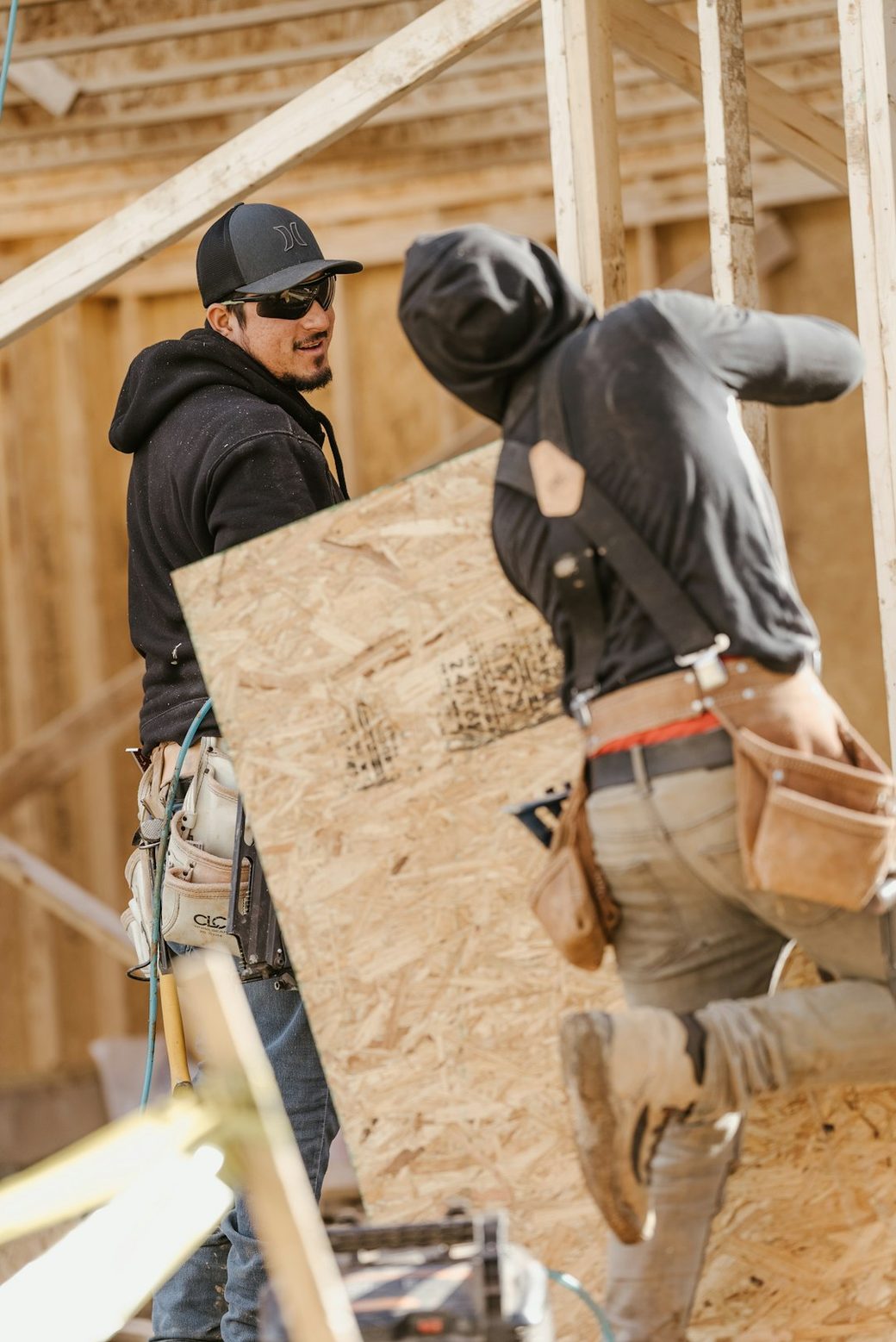 Construction worker framing a wall