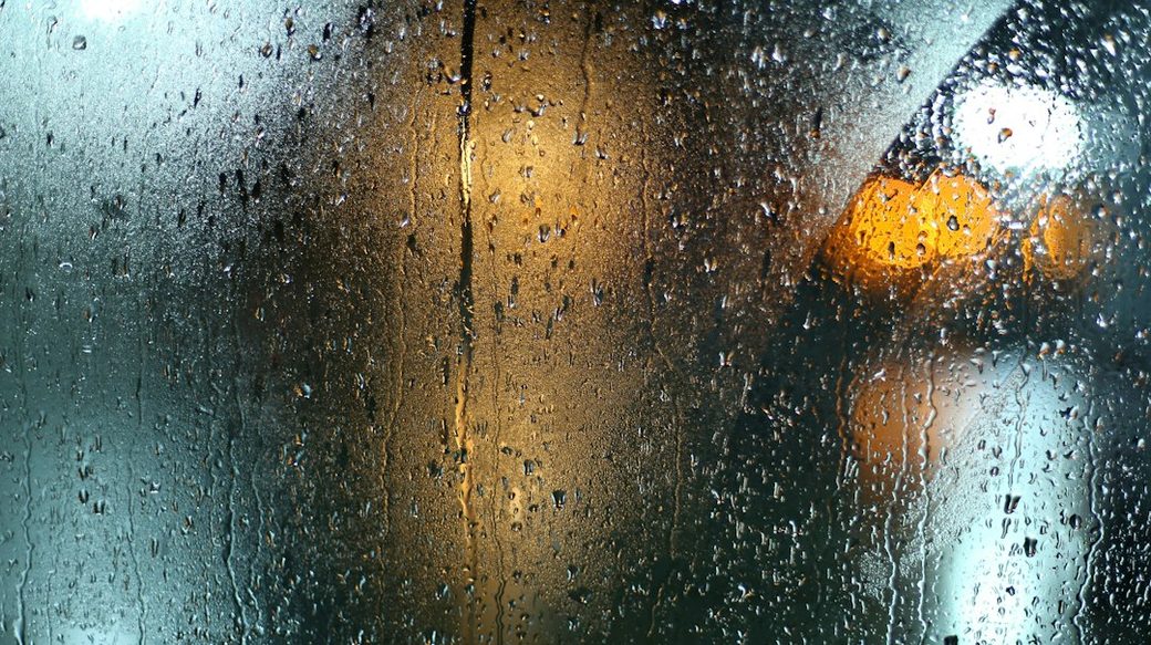 Heavy rain running down a window