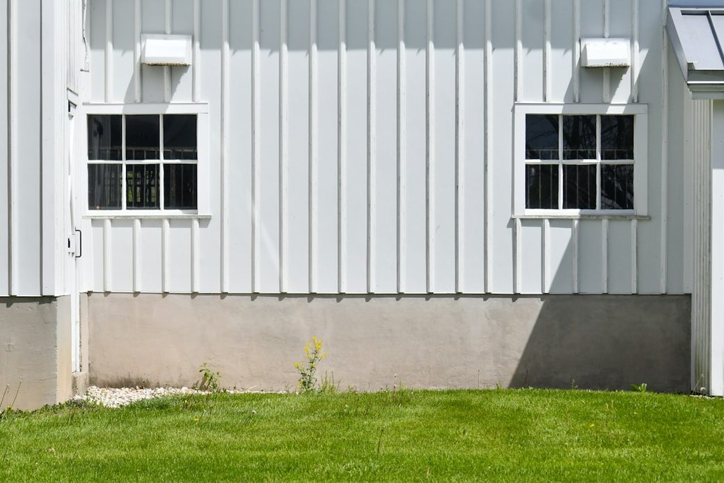 Downspout running along a house exterior
