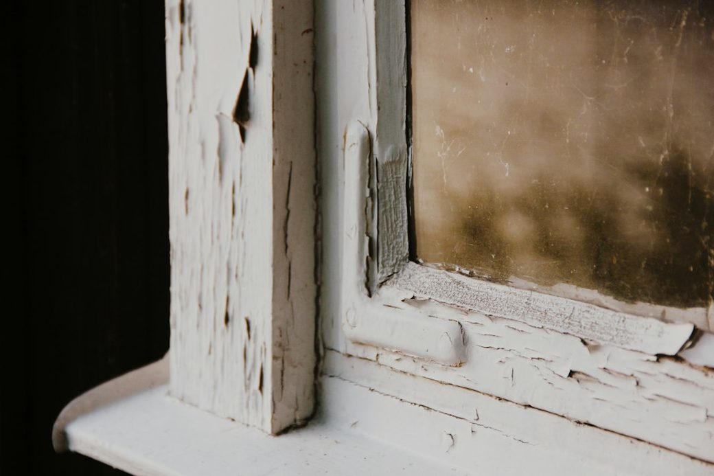 Weathered paint on a window sill