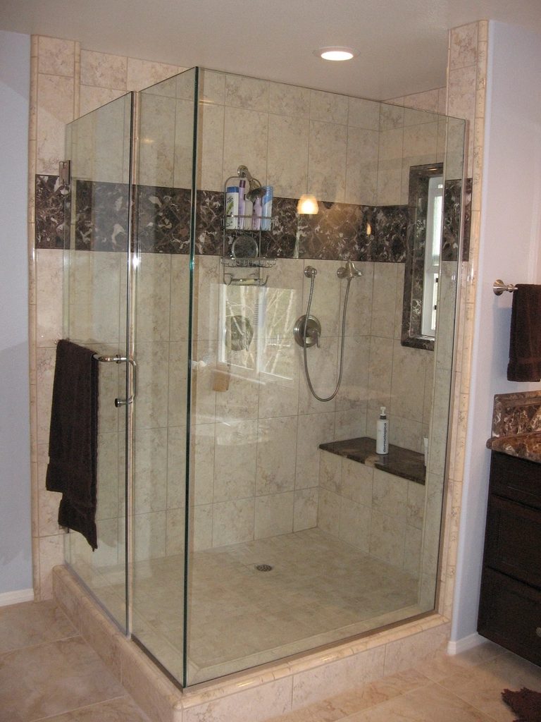 Glass-enclosed tiled shower