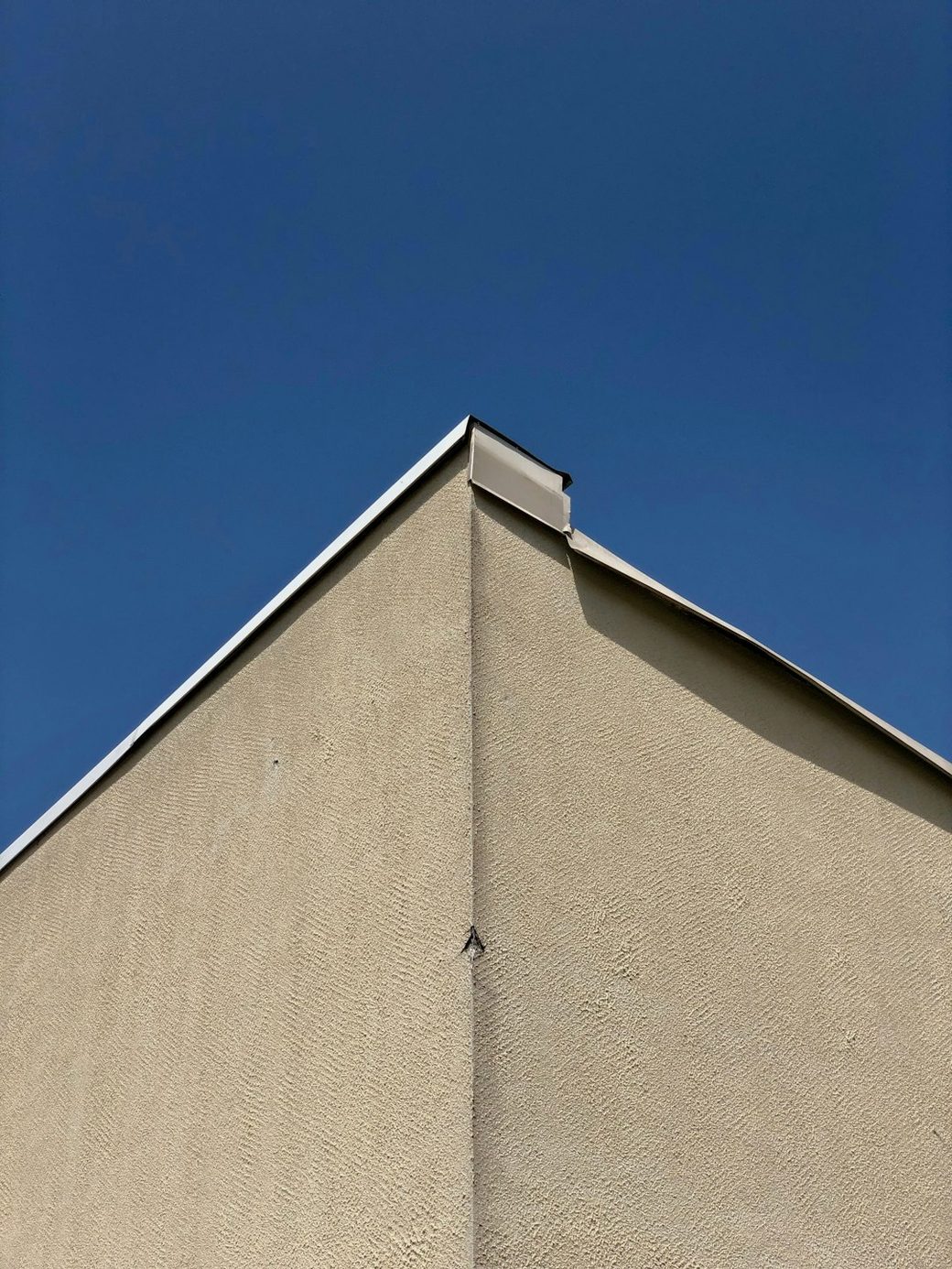 Closeup of exterior wall corner and roofline