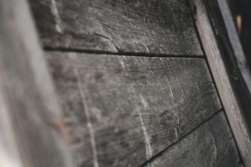 Close up of weathered wood with peeling paint